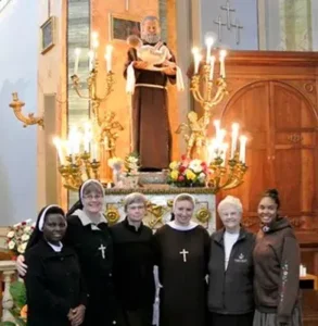 Group of sisters in front of the altar in Rome