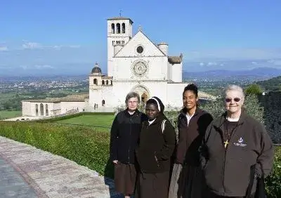 Sisters in front of a church in Assisi