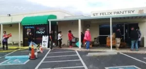 People standing in front of St. Felix Pantry