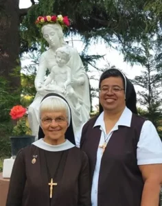 Sisters in front of Mary statue