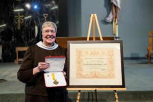 Sister Kujawa accepts an award