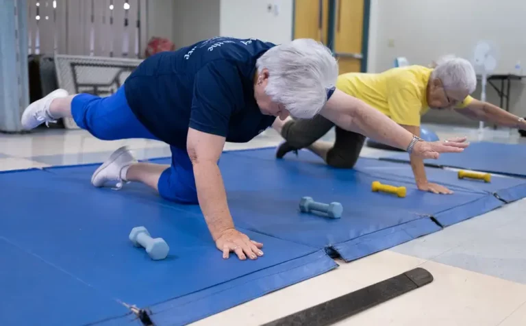 Two individuals exercising at NExT Program