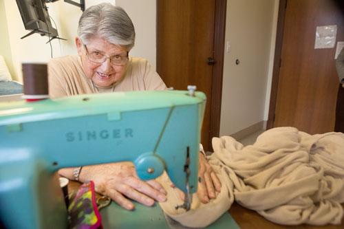 Sister Mary Roseann Godel on sewing machine